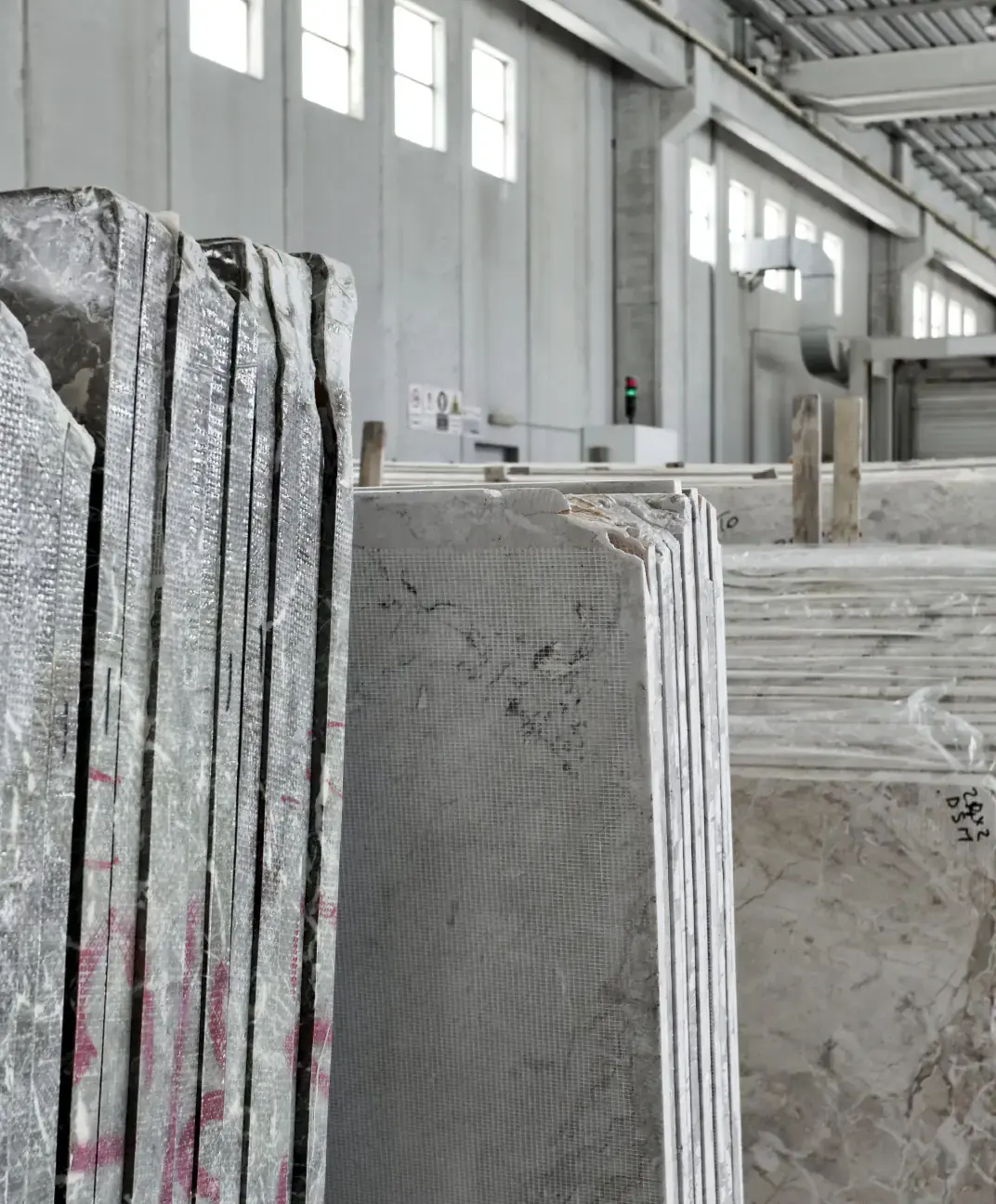 Organized stone slabs in warehouse with OnFind