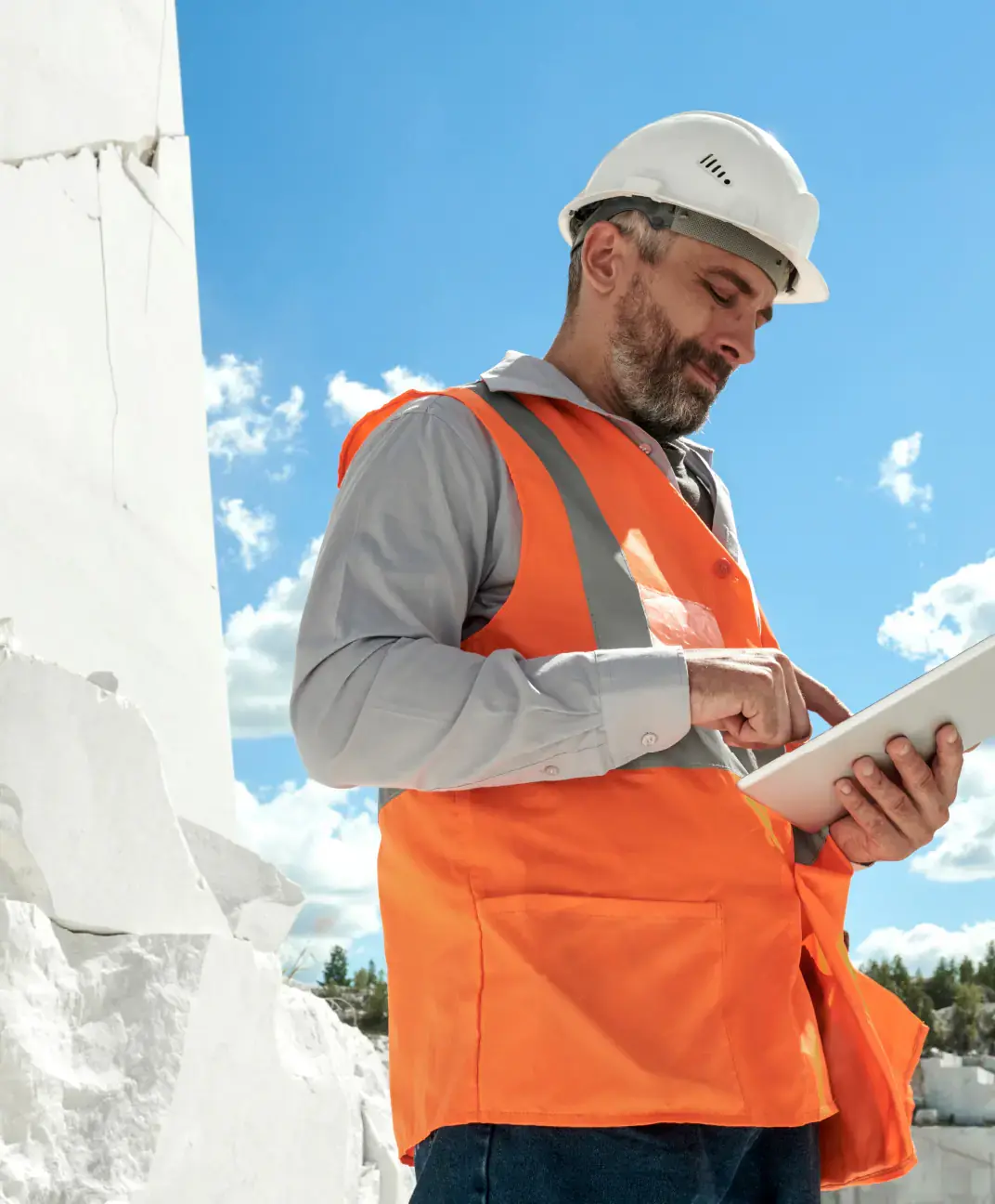 Quarry worker using tablet with OnShopfloor