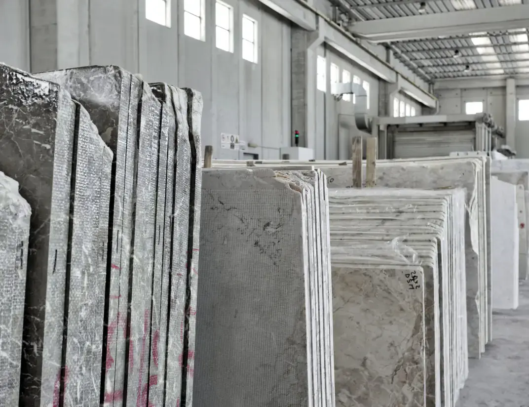 Organized stone slabs in warehouse